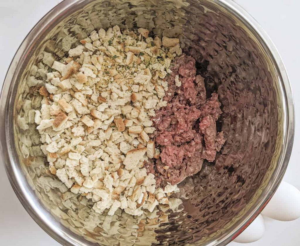 Ground beef and the stuffing in a bowl.