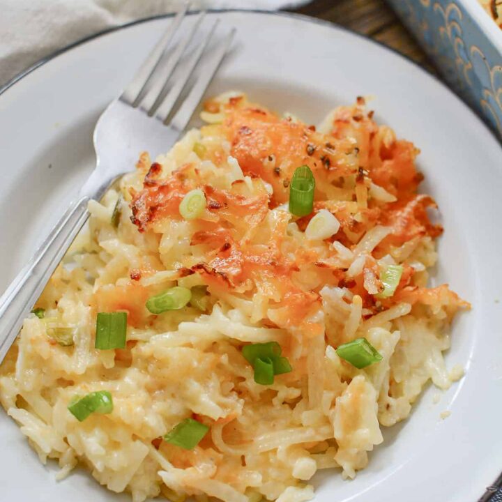 3 Ingredient hasbrown casserole served on a white plate.