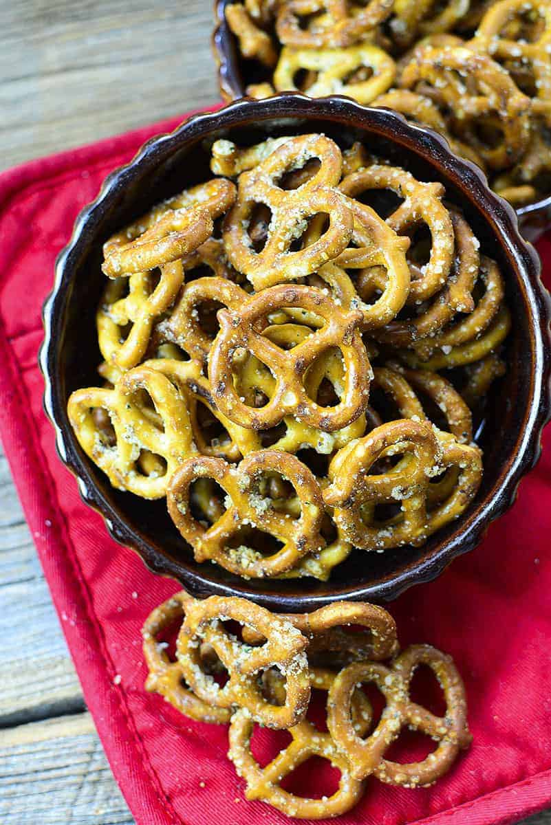 Buttery garlic ranch pretzels in a brown bowl on a red pot holder.