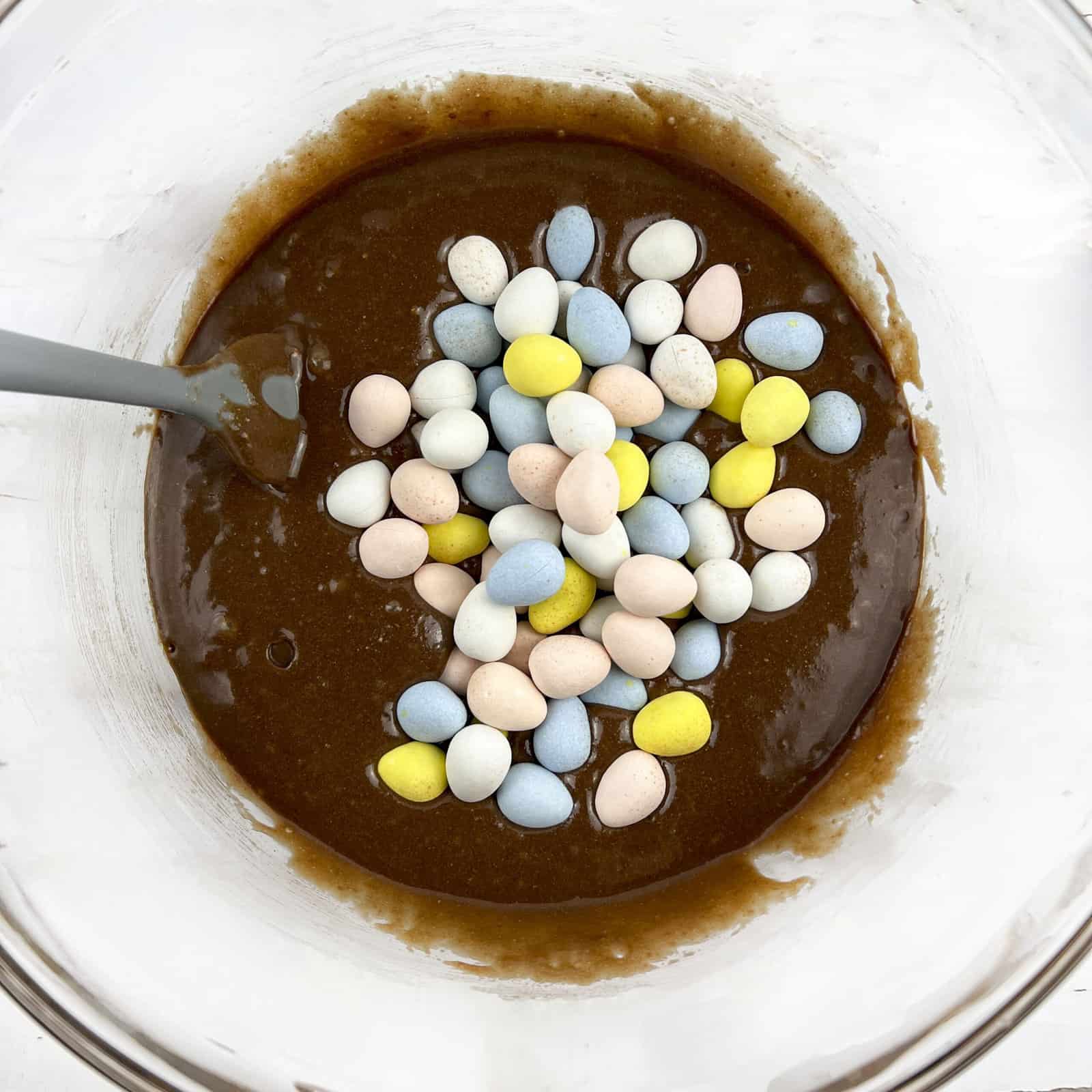 Brownie batter with chocolate mini eggs added.