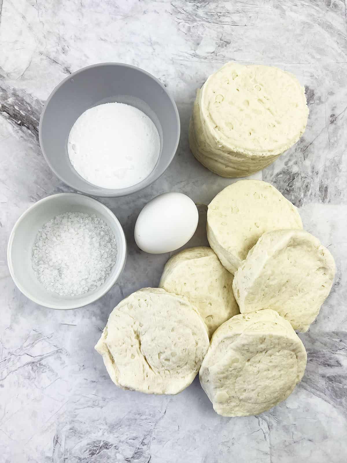 The ingredient photo showing salt, baking soda, and egg, and the biscuit dough.
