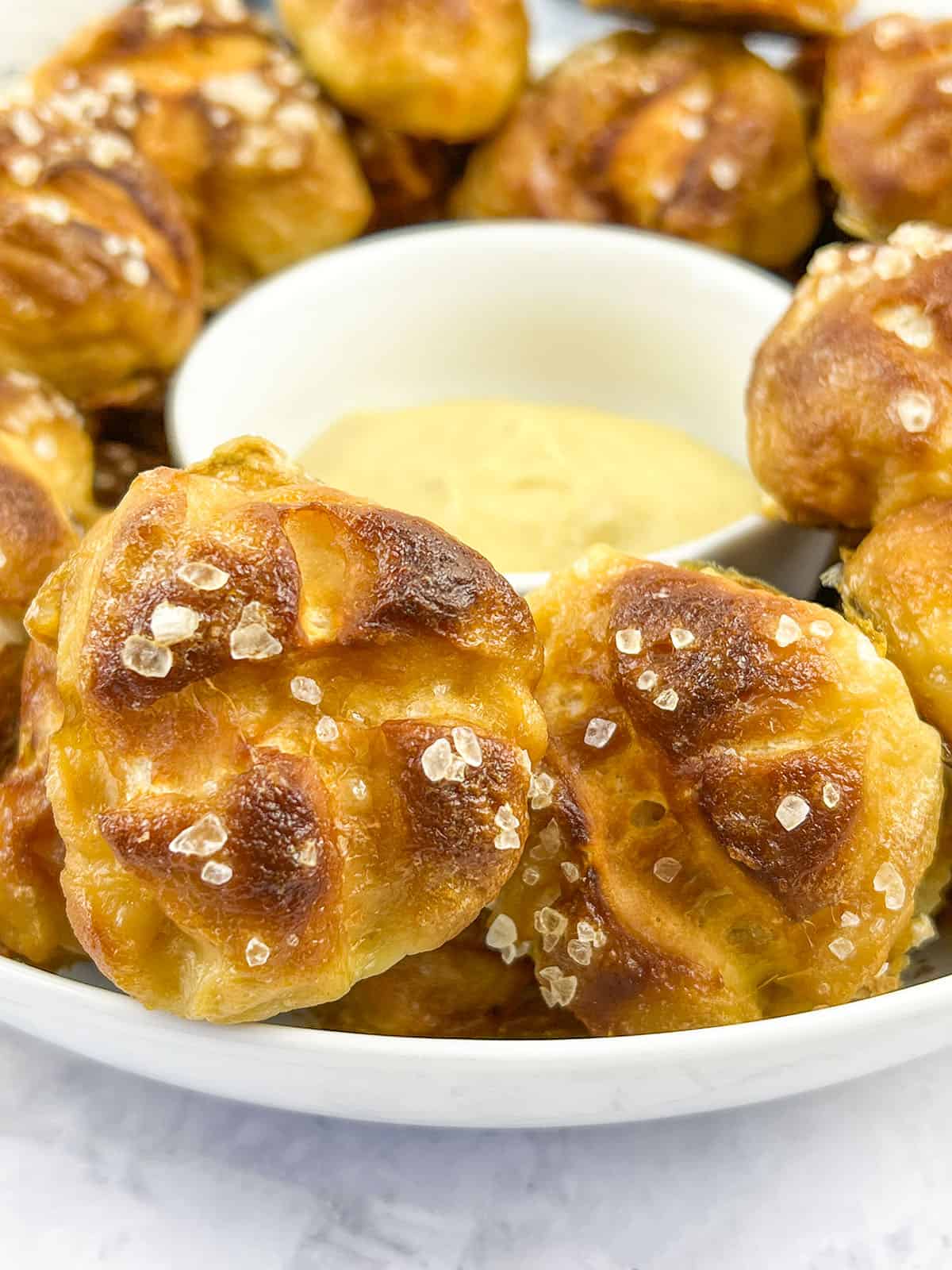 Pretzle knots piled in a white bowl.