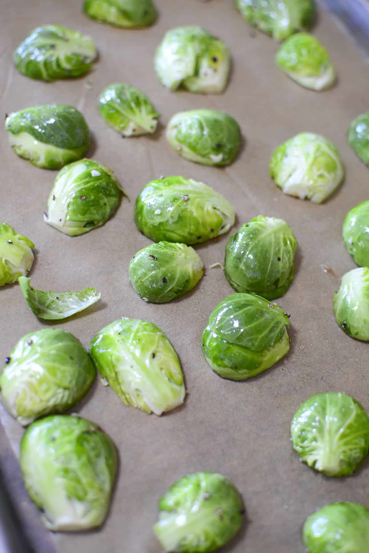 Brussel sprouts, cut side down on a baking sheet.