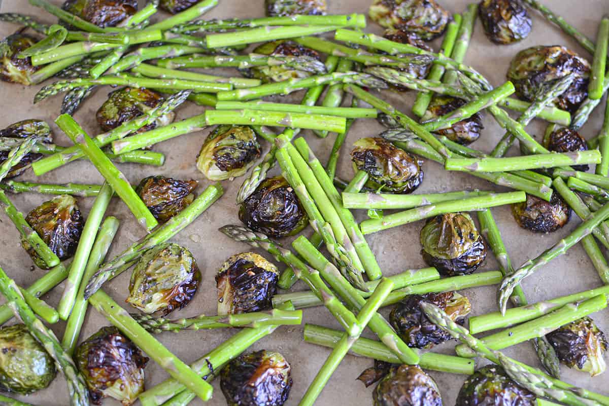 Fresh asparagus added to roasted brussels sprouts
