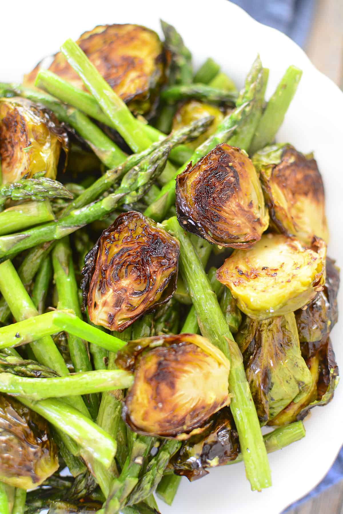 A caramelized brussel sprout with asparagus. 
