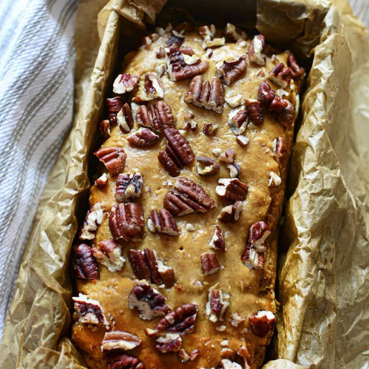4 Ingredient Banana Bread in a parchment lined loaf tin.