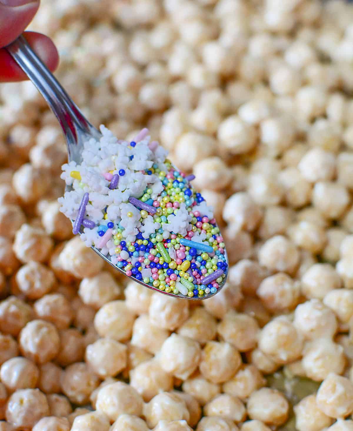 A spoonful of candy sprinkles to go over top the cereal. The warm chocolate will help the sprinkles stick.