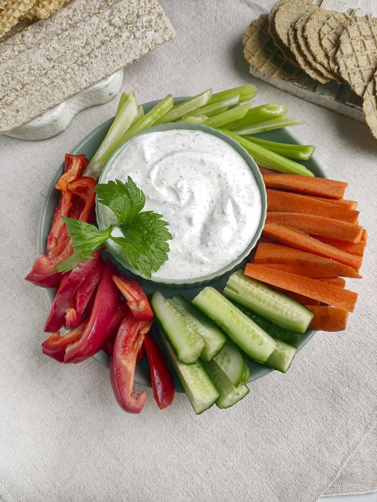 2 Ingredient Ranch Dip in a bowl with vegetables surrounding it. 