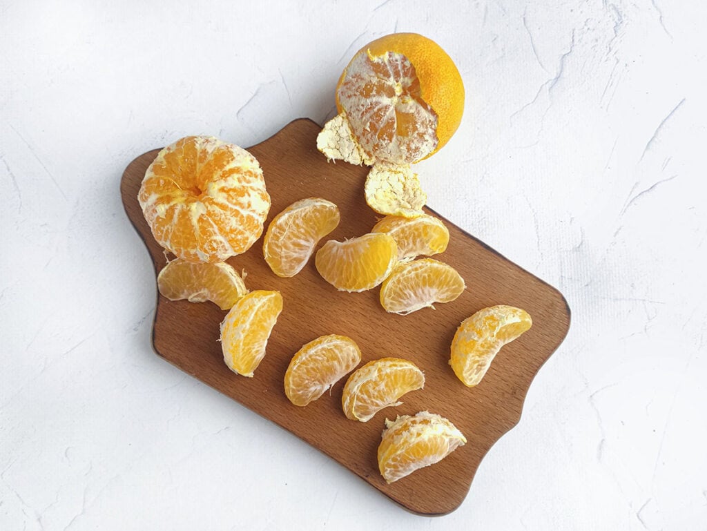 Oranges peeled and separated.