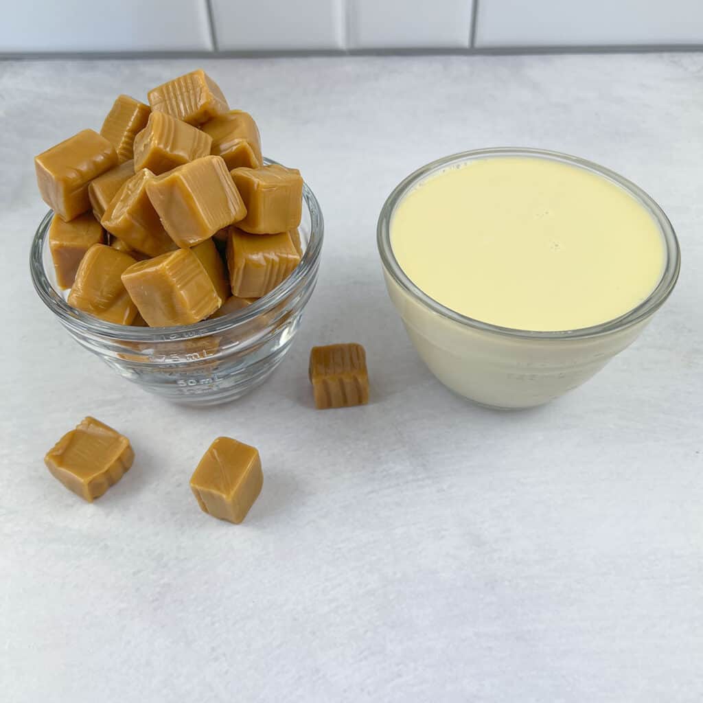The ingredients for caramel sauce - chewy caramel squares and evaporated milk.