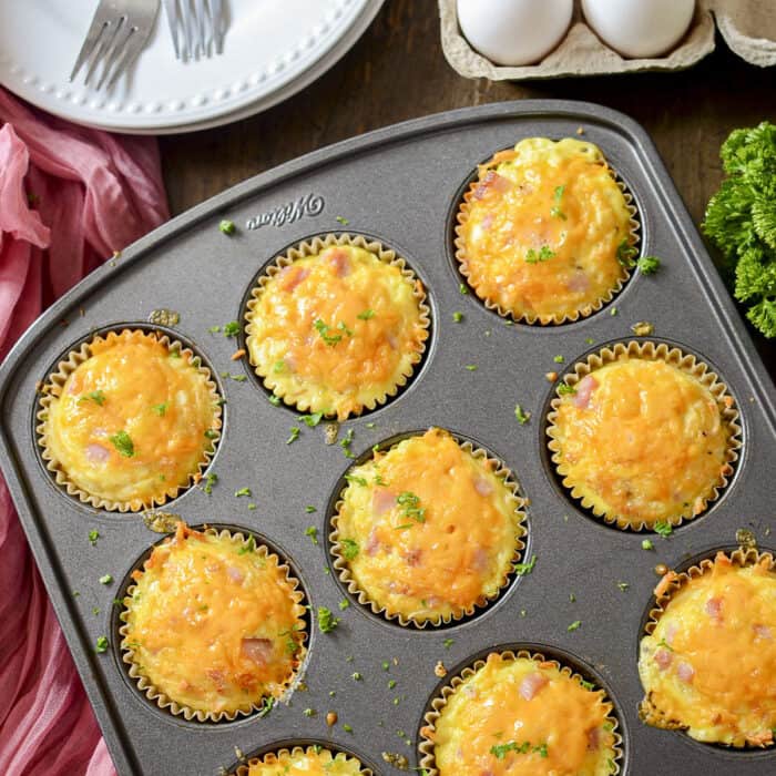 4 ingredient potato nests with ham in a muffin tin.