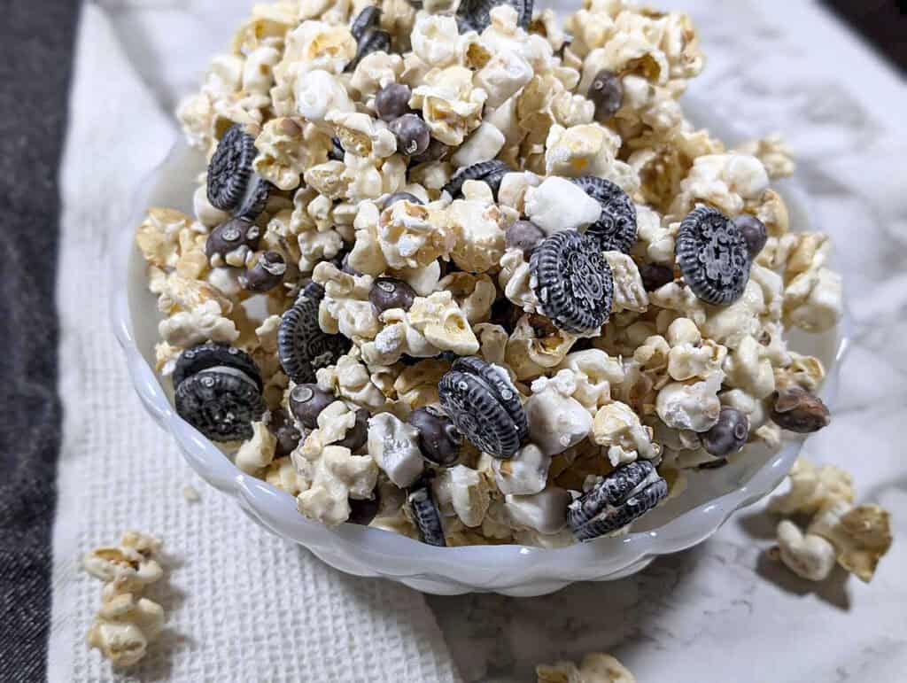 A close up of the sweet and salty popcorn snack on a marble background.