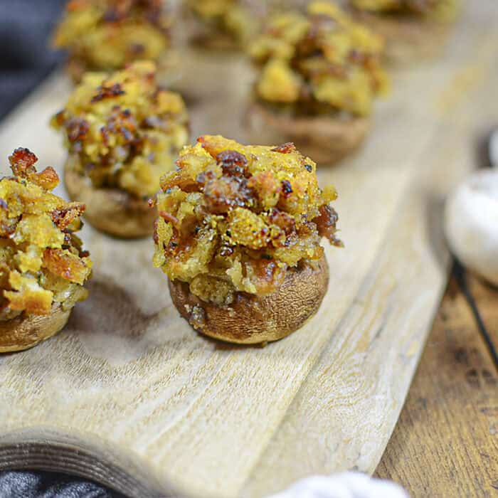 Stuffing stuffed mushrooms square image.