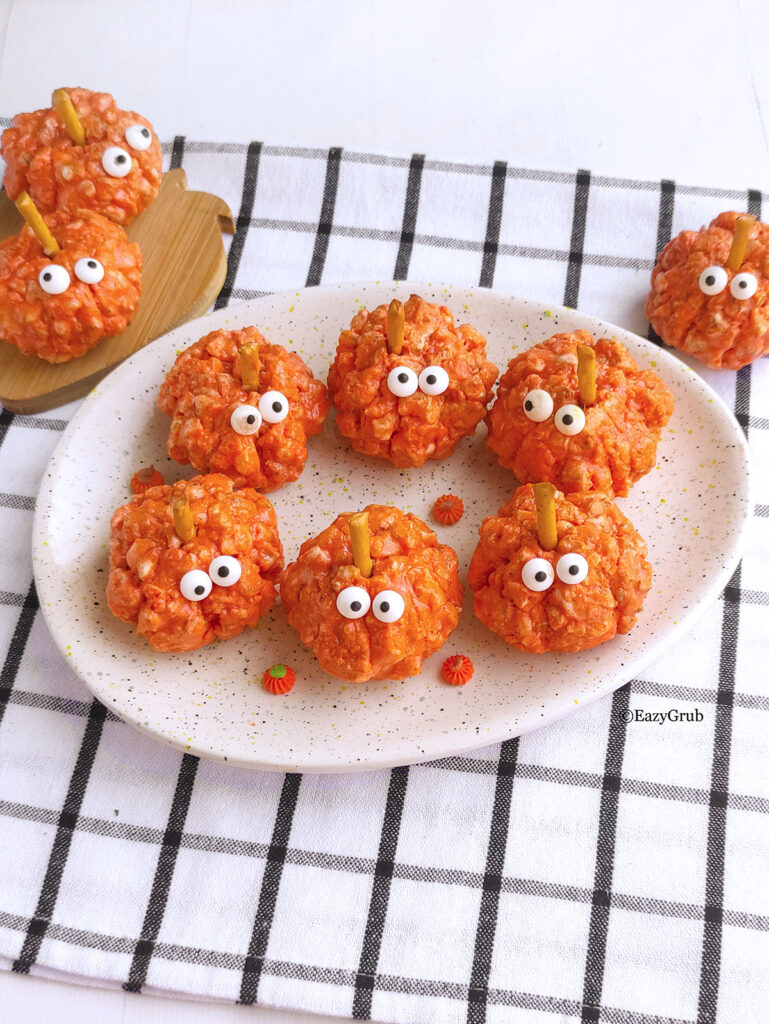 9 pumpkin puffs on plates.