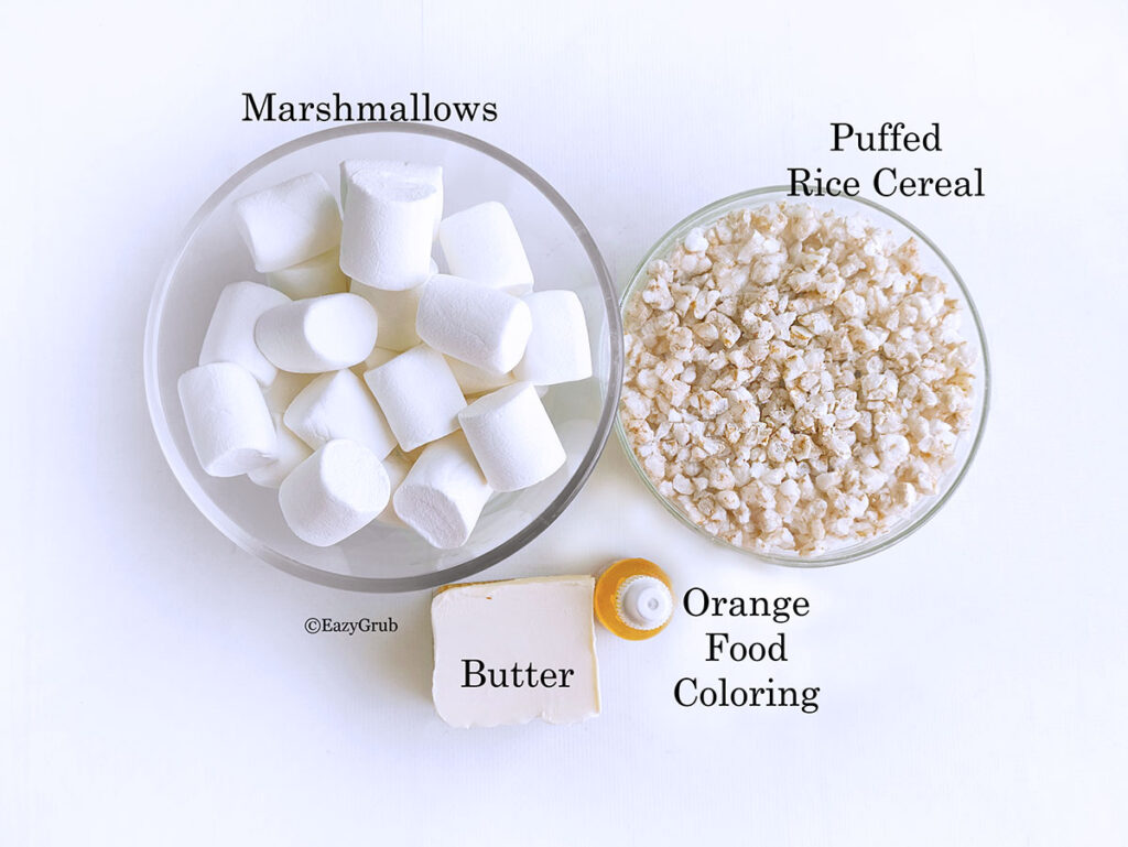 Ingredients for the pumpkin puffs. Marshmallows, crispy cereal, butter and orange food coloring.