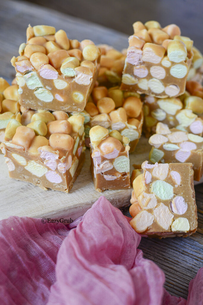 Confetti squares on a wooden board.