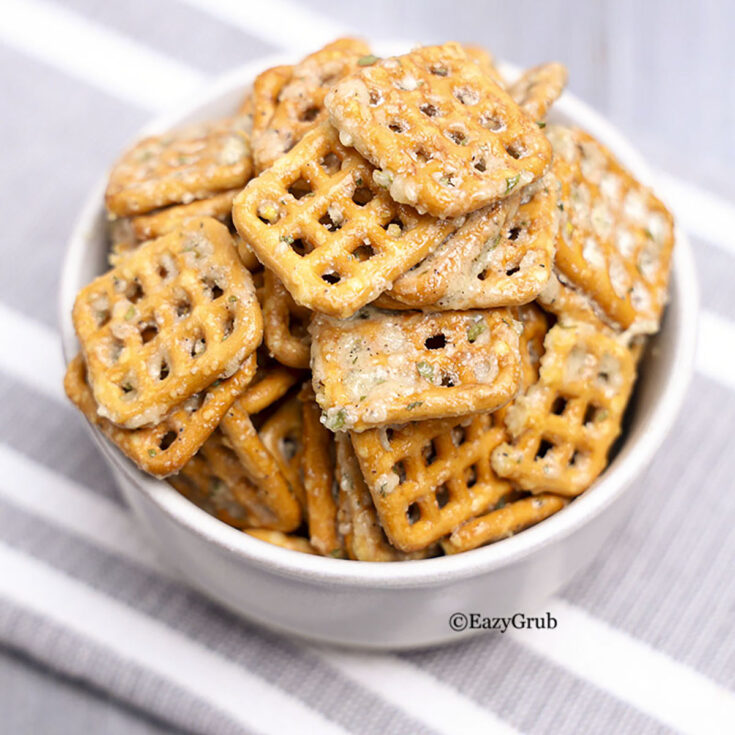 Dill ranch pretzels piled in a bowl, square image.