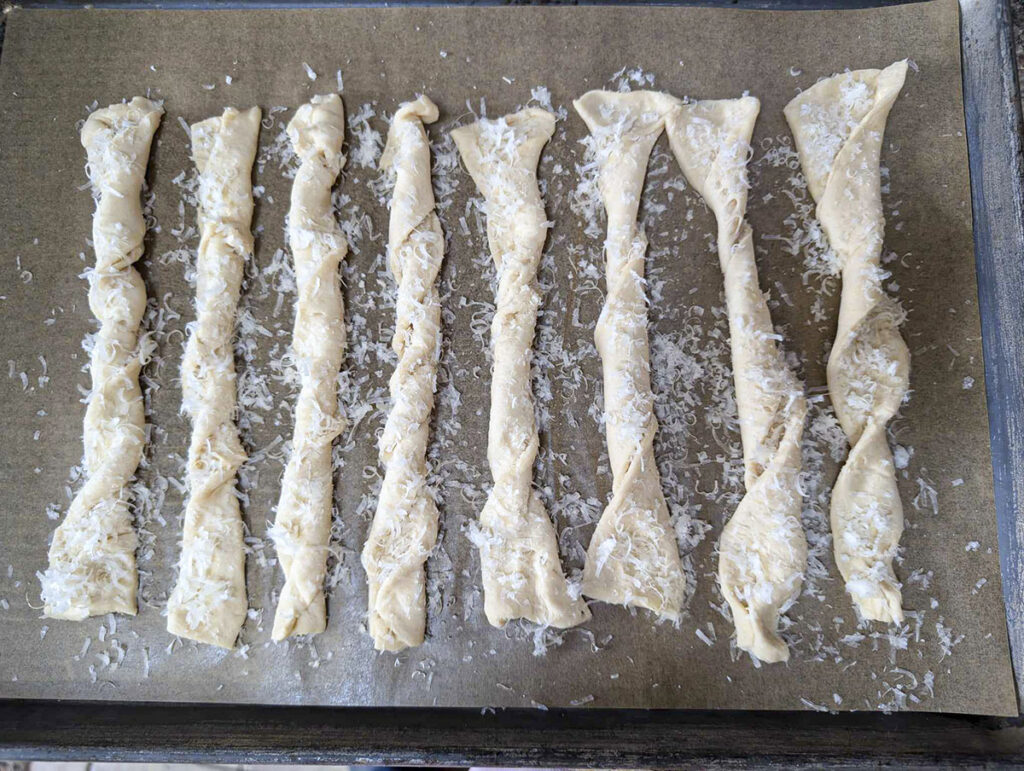 8 raw garlic bread twists ready to bake.