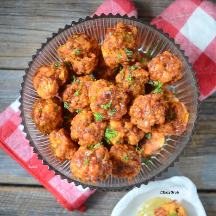 A bowl of Chorizo sausage balls on a check oven mitts
