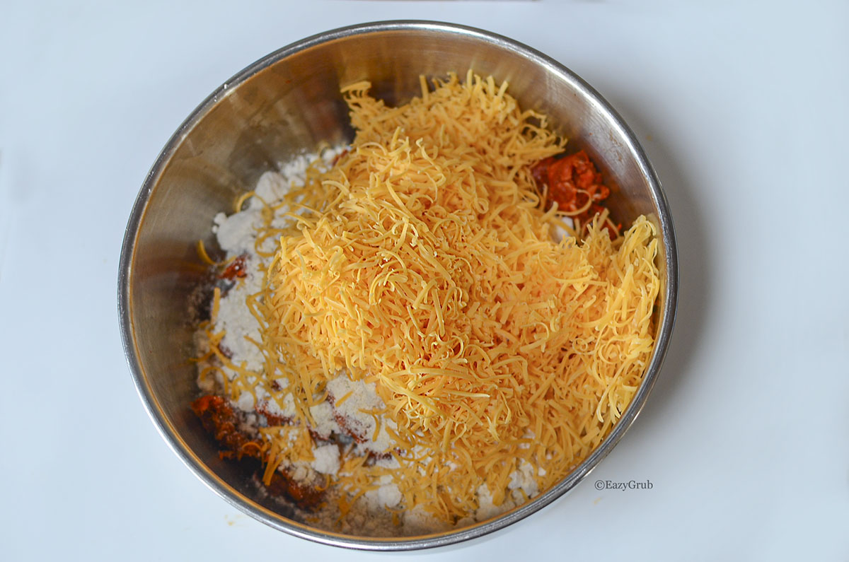 Ingredients for chorizo sausage balls in a mixing bowl.
