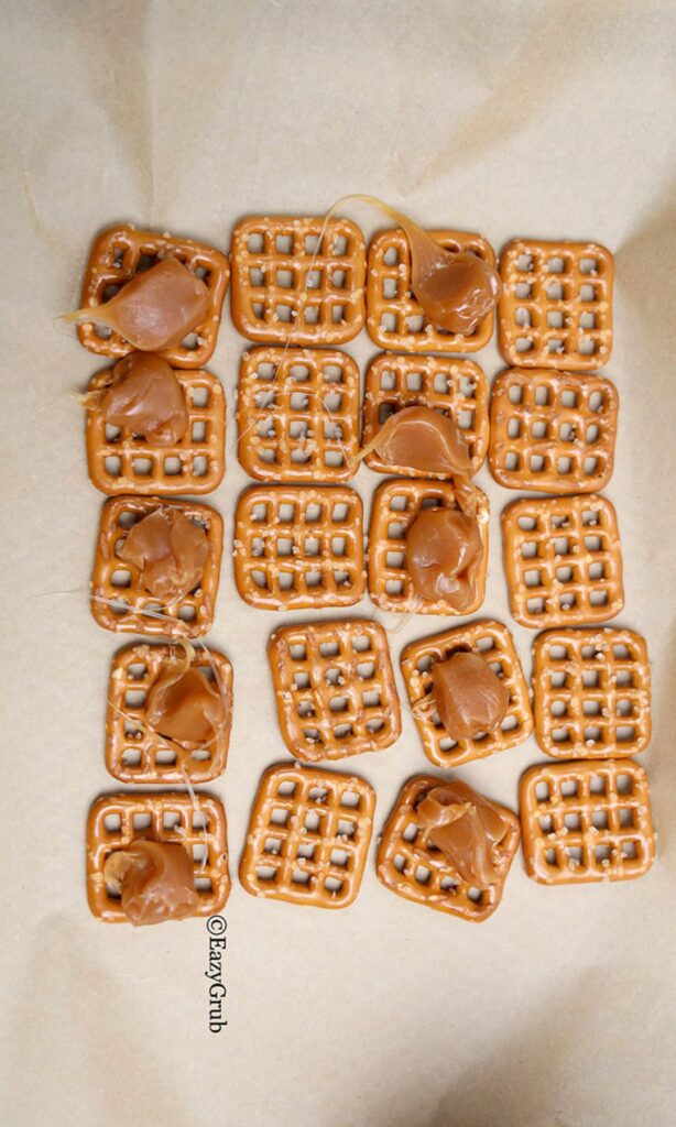 Pretzels with caramels on half of them.