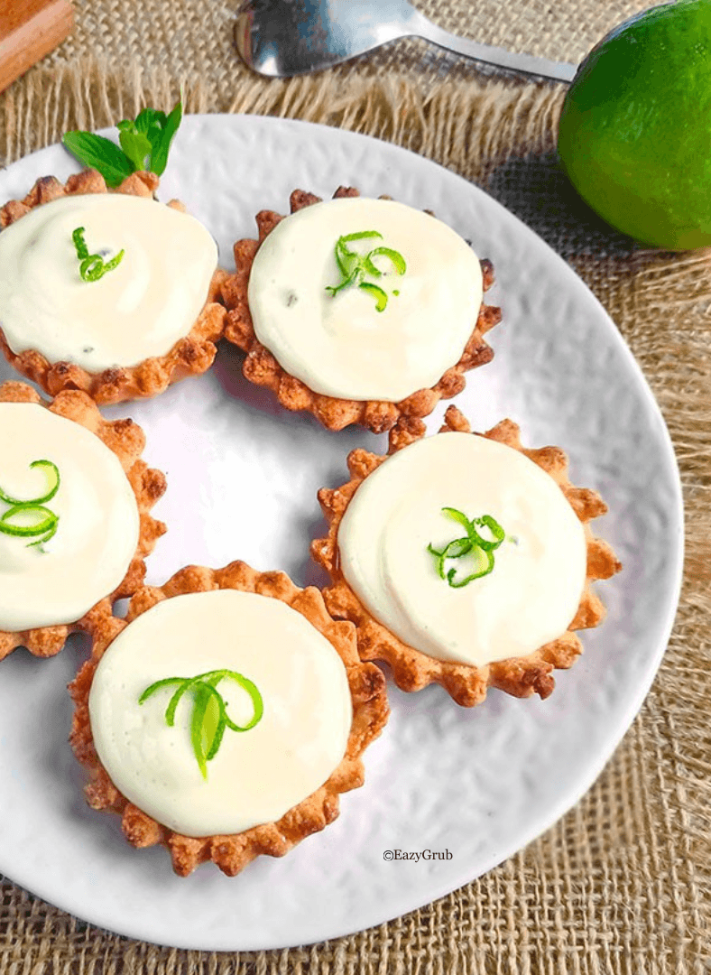 Close-up of bright and tangy no-bake lime tart on a white serving plate