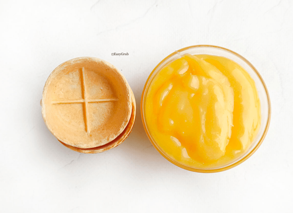 Premade mini tart shells and bowl of lemon curd