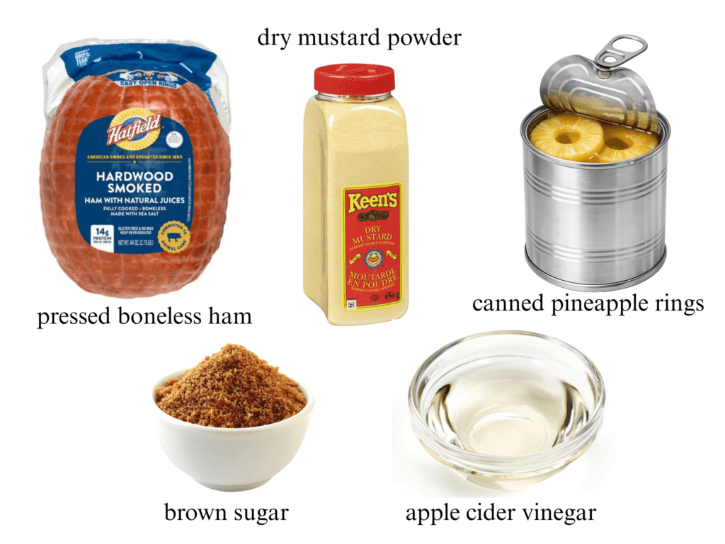An organized ingredient layout on a white background featuring a package of Hatfield Hardwood Smoked boneless ham, a tall container of Keen’s dry mustard powder, an open tin of canned pineapple rings, a small white bowl of brown sugar, and a glass bowl of apple cider vinegar.