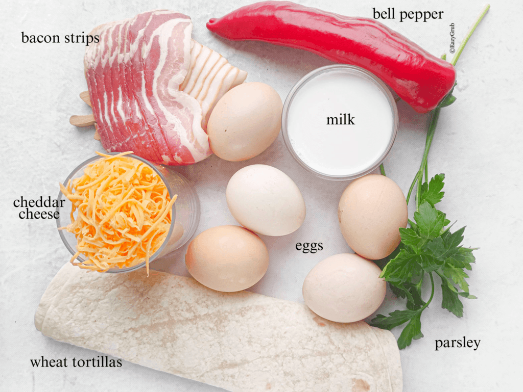 Ingredient photo for the burritos. Bacon, red pepper, milk, eggs, parsley, tortillas, and cheddar cheese.