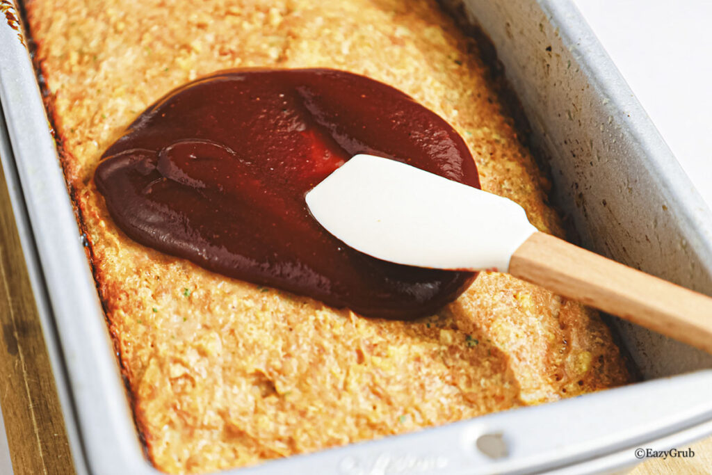 Adding the extra bbq sauce.