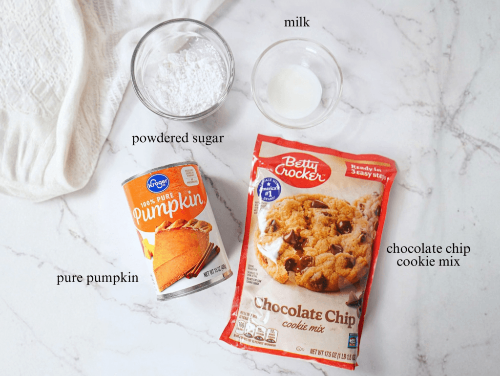 Ingredients for pumpkin bars. Powdered sugar, milk, pure pumpkin puree, and chocolate chip cookie mix.